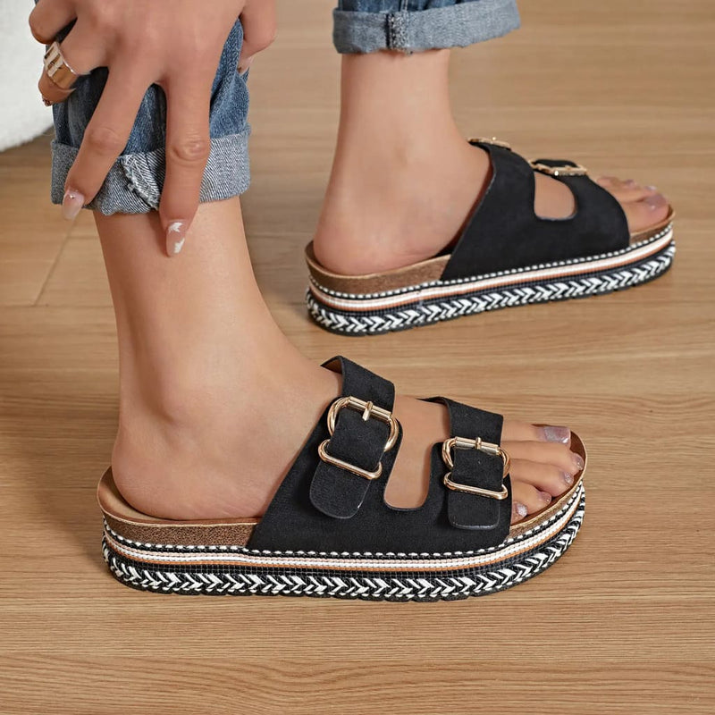 Mules femme à plateforme en suédine noire avec boucles dorées